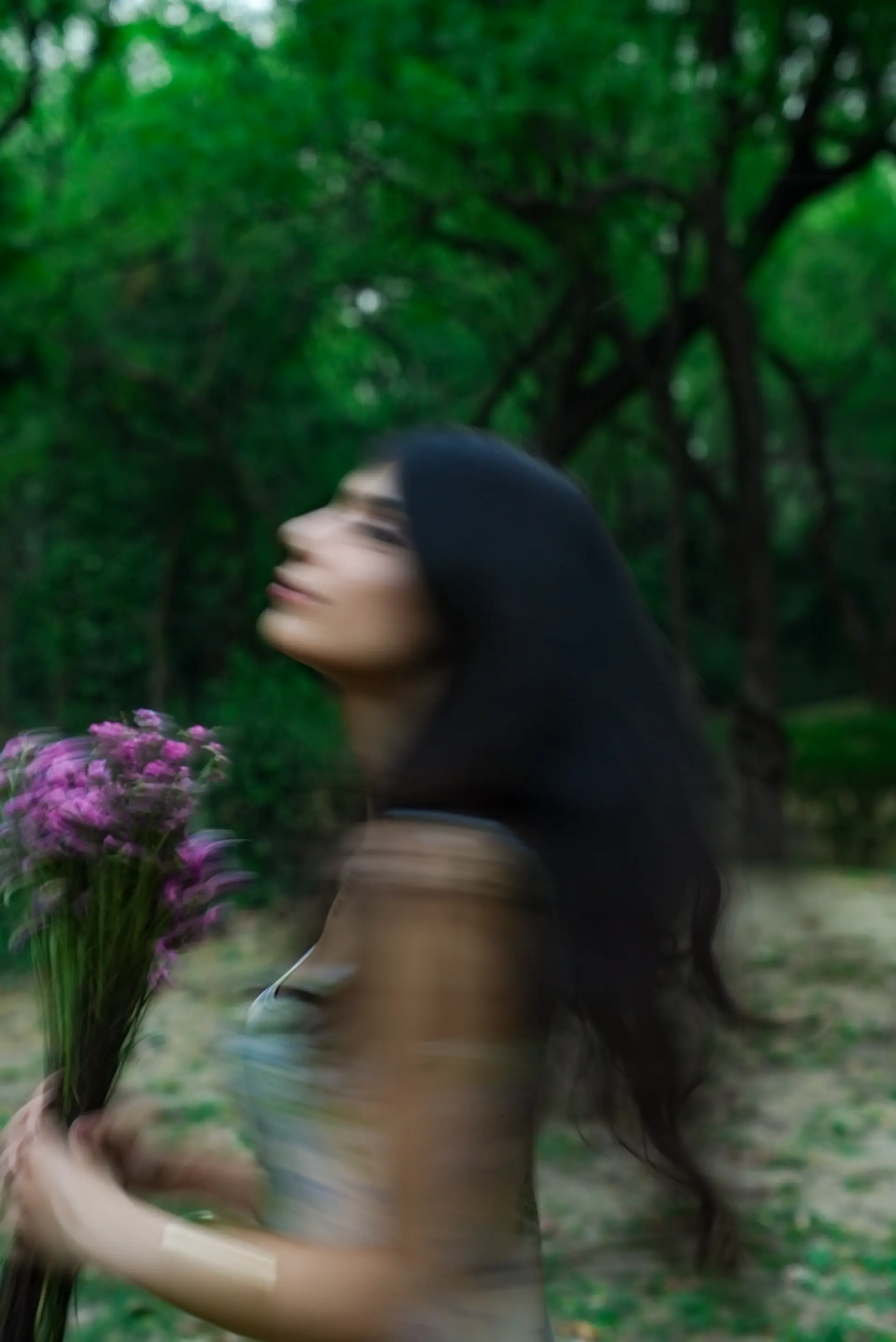 Woman holding flowers in a garden